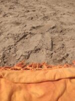 brown textile on gray sand